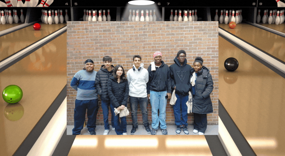 Students bowling together in a bowling alley